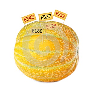 Fresh melon with E numbers isolated. Harmful food additives