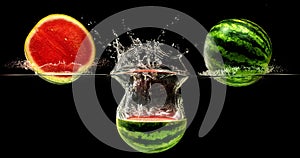 Fresh melon falling in water