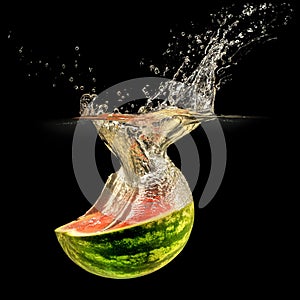 Fresh melon falling in water with splash on black