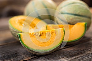 Fresh melons on wooden table