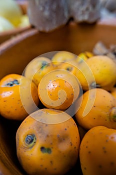 Fresh Mexican hawthorns in a handmade clay bowl