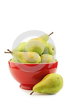 Fresh migo pears in a red ceramic bowl