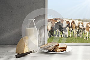 Fresh milk,cream bottle on window sill in countryside