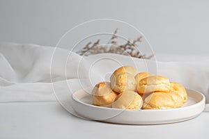Fresh milk eclair in white plate