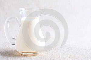 Fresh Milk in a Pitcher on a White Backgrounds