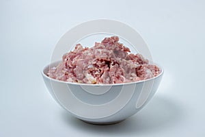 Fresh minced meat on a white plate.