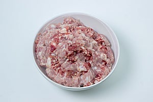 Fresh minced meat on a white plate.