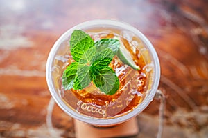 fresh mint on ice in glass with slice lime