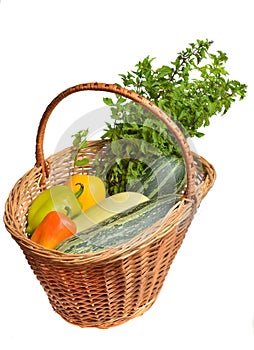 Fresh mint, yellow and green zucchini and Bell peppers in basket