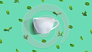 Fresh mints with tea cup overhead view