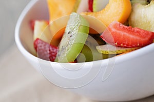 Fresh mix fruit salad with strawberry, kiwi and peach