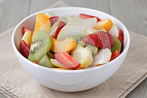 Fresh mix fruit salad with strawberry, kiwi and peach