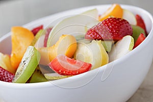 Fresh mix fruit salad with strawberry, kiwi and peach