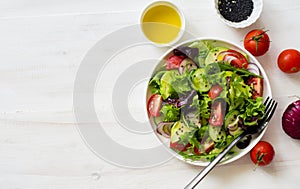 Fresh mix green leaves, tomatoes, avocado and cucumber salad