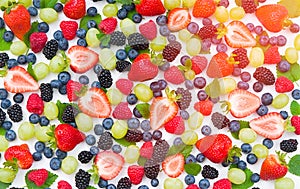 Fresh mixed fruits , strawberries , blueberries background.Healthy food , diet.