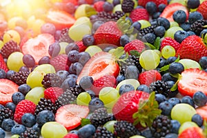 Fresh mixed fruits , strawberries , blueberries background.Healthy food , diet.