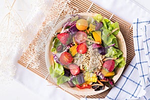 Fresh mixed fruits and vegetables salad, Healthy vegan food, Top view