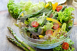 Fresh mixed salad with green asparagus for healthy snack