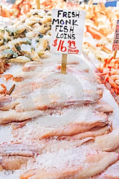 Fresh monkfish loins on ice for sale at Pike Place Market in Sea