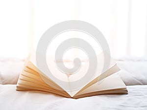 Fresh morning read book on the bed