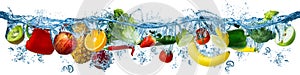 Fresh multi fruits and vegetables splashing into blue clear water splash healthy food diet freshness concept isolated white