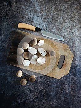 Fresh Mushroom on cutting board with knife