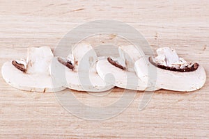 Fresh mushrooms on the wooden breadboard