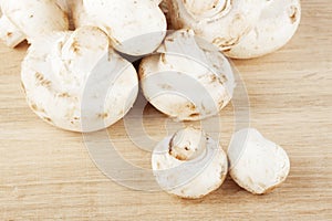 Fresh mushrooms on the wooden breadboard