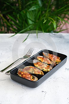 Fresh mussel baked with cheese