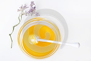 Fresh natual honey in glass bowl with honey spoon