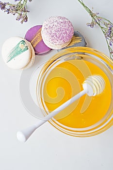 Fresh natual honey in glass bowl with honey spoon