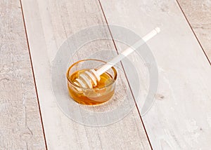 Fresh natural honey in jar with spoon