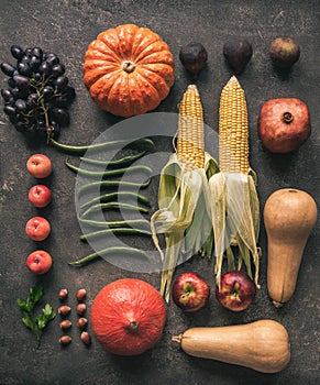 Fresh natural vegetables and fruits. Flat lay seasonal vegetables and fruits on gray background