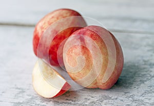 Fresh nectarine on wood background