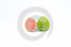 Fresh one whole green guava fruit and a half with leaves or Psidium guajava, isolated on white background.