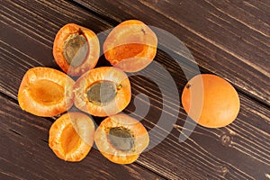 Fresh orange apricot on brown wood