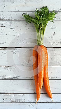 Fresh orange carrot presented elegantly on a white wooden background