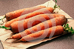 Fresh orange carrots on a wooden table