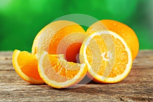 Fresh orange fruit on grey wooden background.