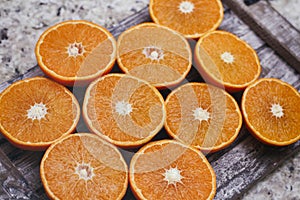 Fresh orange fruit. Halves of citrus background. Cut fresh fruits on wooden table.