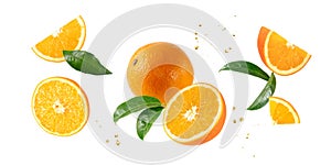 Fresh orange fruit whole and slices with leaves falling flying isolated on white