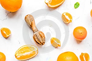 Fresh orange fruits with mint on table background top view pattern