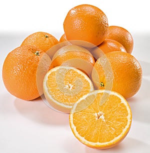 Fresh orange fruits on white