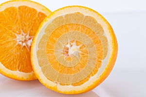 Fresh orange halved to show the pulp