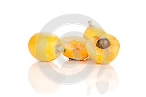 Fresh orange Japanese loquats isolated on white