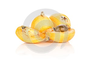 Fresh orange Japanese loquats isolated on white