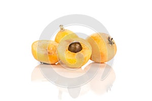 Fresh orange Japanese loquats isolated on white