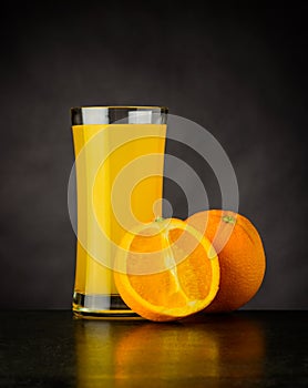 Fresh Orange Juice on Dark Background
