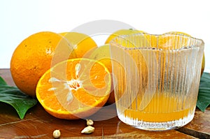 Fresh orange and juice in glass