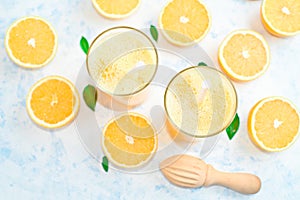 Fresh orange Juice and oranges on the cutting board